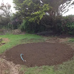 hole that has been covered in the ground
